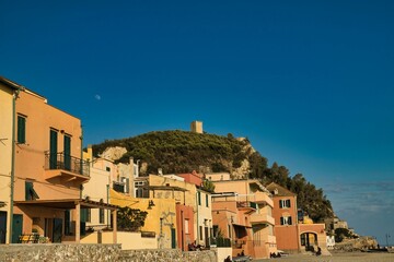Fototapeta premium the Saracen village of Varigotti, its warm colors and its beaches on the western Ligurian coast, in the province of Savona