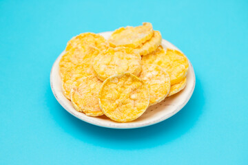 small mini crispy corn diet toasts on white dish