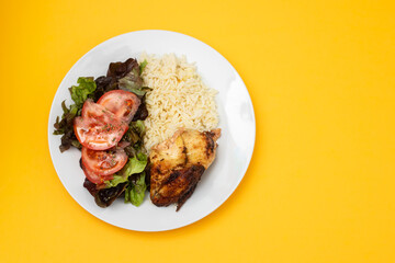 grilled chicken with boiled rice and fresh salad