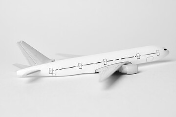 Airplane on white background with copy space, close-up