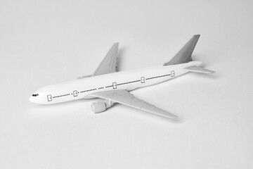 Airplane on white background with copy space, close-up