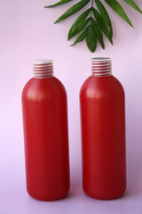 Red cosmetic shampoo bottles.