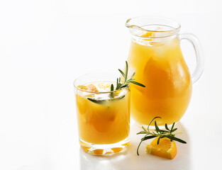 Gin with grapefruit or orange and rosemary, refreshing drink with ice isolated on white background. Refreshing summer cocktail, selective focus.