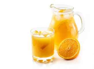 Jug and glass of tasty cold juice from grapefruit or orange, refreshing drink with ice isolated on white background. Refreshing summer cocktail, selective focus.