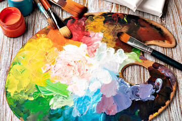 art palette with colorful mixed paints
