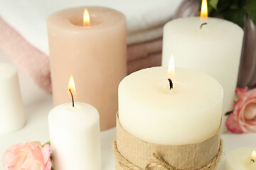 Fototapeta na wymiar Concept of relaxation with aroma candles, close up