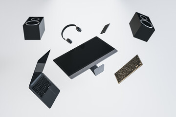 Abstract flying tech pieces on white background. Laptop computer, speakers and headphones. Music and technology concept. 3D Rendering.