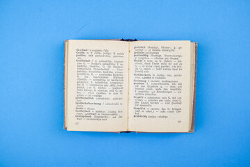 Obraz premium Old, Vintage Bible book on blue background