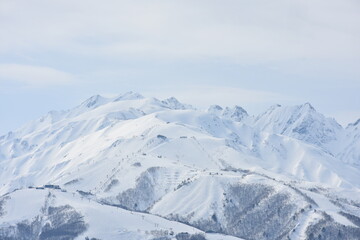 Fototapeta na wymiar Snowy Mountains in Tsugaike Highlands