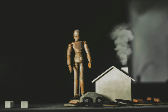 Wooden figurine, house and wooden car.