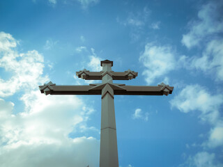 Orthodox cross against the blue sky. God and religion.