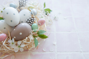 Fototapeta na wymiar Easter eggs in straw nest