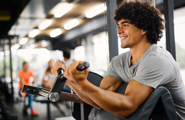Portrait of fit man working out in gym. Sport people healthy lifestyle exercise concept