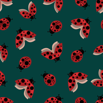 Seamless pattern with the image of flying and crawling ladybugs on a green background for printing on fabric and other surfaces