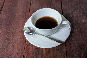 Cup of coffee on wooden table