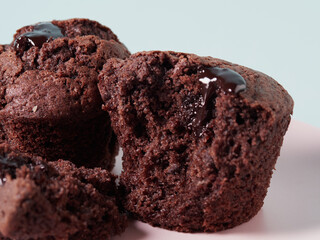 Chocolate cupcakes with cherry jam isolated on a white background. Chocolate muffin. High quality photo