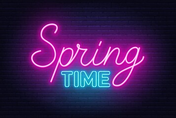 Spring Time neon quote on a brick wall.