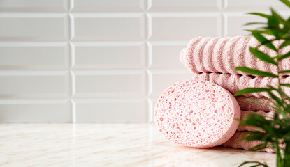 Marble table in the bathroom with free space, shadows of light on the tiled wall 