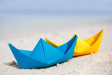 colorful paper boats at the tropical beach