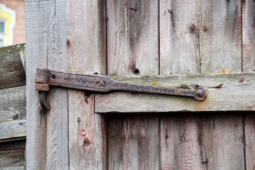 Forged loop in the wooden gates of an old manor.