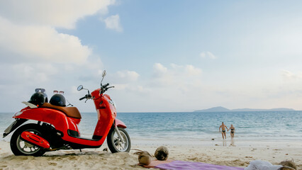 Obraz premium Scooter road trip. Lovely couple on red motorbike in white clothes on sand beach. Wedding just married people walking near tropical palm tree, sea. Honeymoon by ocean. Asia Thailand. Motorcycle rent.