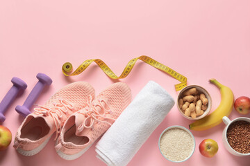 Sportive shoes, dumbbells, towel, measuring tape and healthy products on pink background