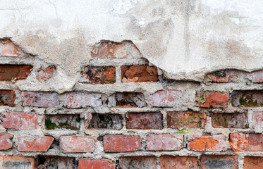 Old wall with brickwork under plaster