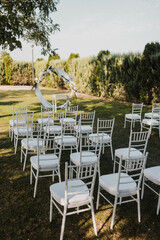 Table setting at a luxury event and beautiful flowers on the table. Beautiful wedding arch of flowers.