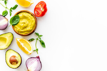 Spicy guacamole avocado dip with herbs and tomatoes