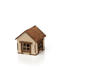 Small wooden house isolated on white background. Copy space.