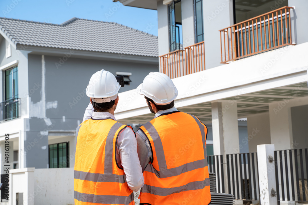 Poster architect and engineer discussing planning for a building a new home at construction site,architect 