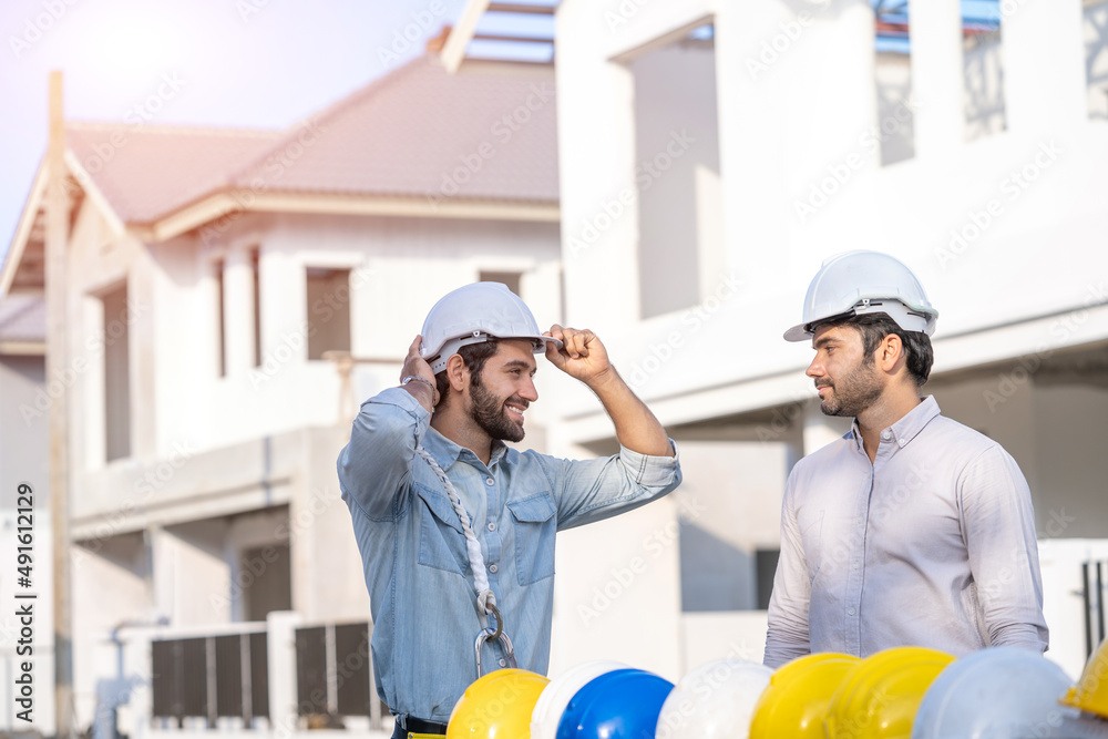 Aufkleber two architects working on blueprints