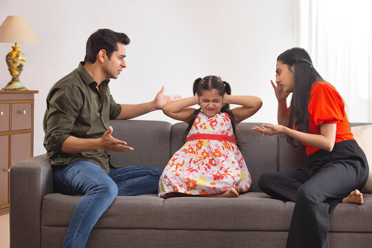 Parent  scolding their daughter for disobedience