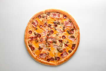 Pizza with bacon, sausages, beef and cheese, on a white background