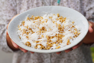Thai dessert, wheat rice steamed with coconut ( Khao Sa Lee) in culture market at Thailand. Selectivefocus and free space for text.
