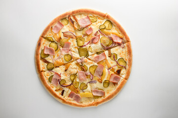 Pizza with pickles, bacon, potatoes, onions and cheese on a white background
