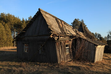 Fototapeta na wymiar Vintage abandoned destroyed wooden house