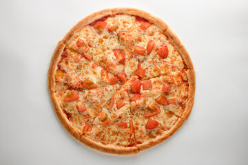 Pizza with tomatoes, oregano and cheese on a white background