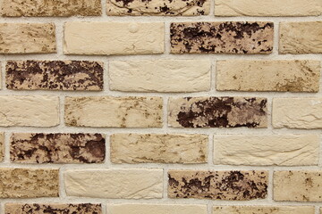 Brick wall with scuffed brick, white-brown brick background