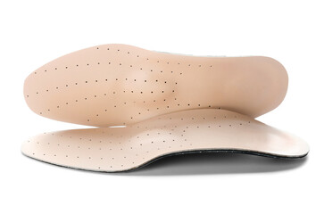 Pair of orthopedic insoles isolated on white background