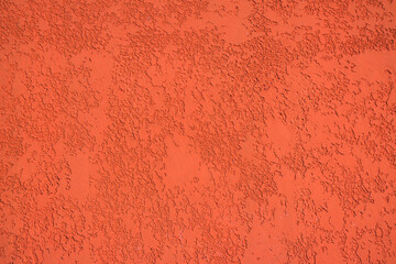 Close-up, texture of a facade made of decorative red plaster.