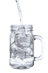 pour water in glass with ice  isolated on white background clipping path