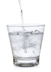 pour water in glass with ice  isolated on white background clipping path