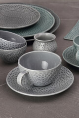 Crockery on a grey textured stone.