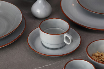 Crockery on a grey textured stone.