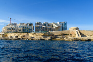 Apartments at the end of Sliema, Malta, overlooking Fort Tigne and the ocean.