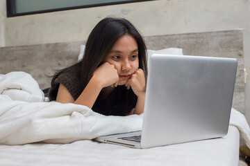 Fototapeta premium Portrait Asian beautiful young woman using laptop computer in home living room isolated on white background 