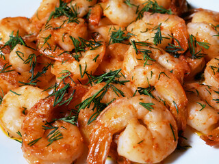 Fried king prawns on a white plate, close-up