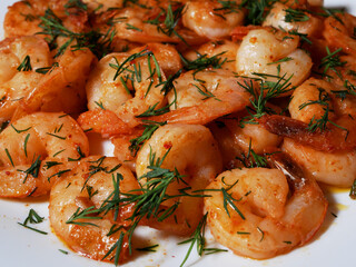 Fried king prawns on a white plate, close-up