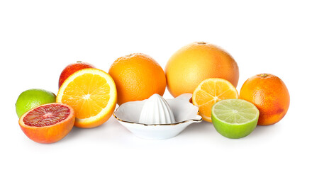 Ceramic juicer and citrus fruits on white background